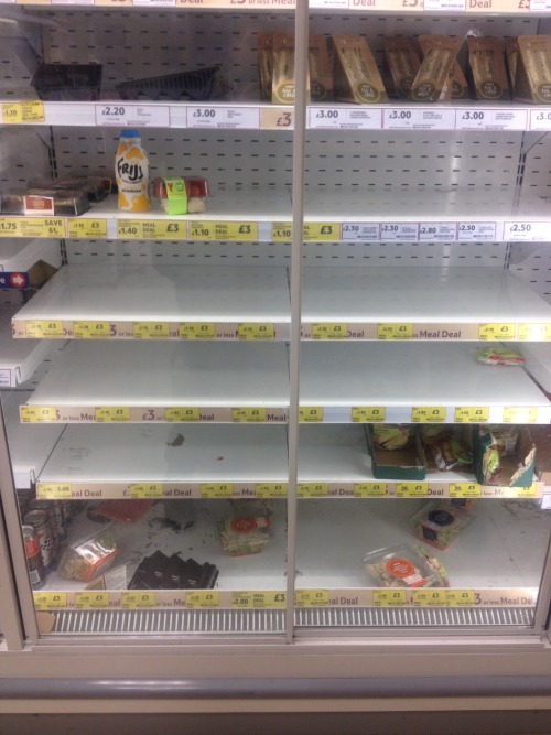 Half-empty shelves in a supermarket
