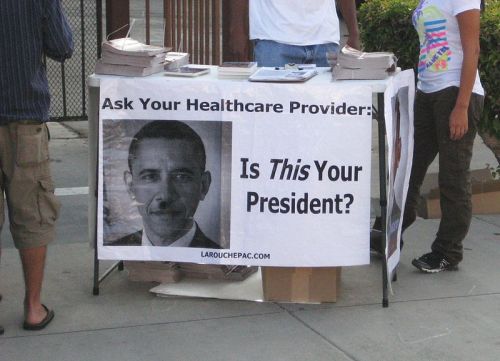 Protesters portray Obama as Hitler