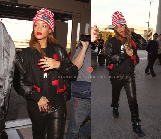Rihanna was spotted at LAX catching a flight to London, England to debut her Rihanna for River Island line wearing a Black Pyramid Limited Edition &#8216;Love Not Hate&#8217; Jacket, a red and white Joyrich hat, a Joyrich ss2013 python PU backpack, We Are Massiv&#8217;s no mental slavery tee, Joseph leather jogging pants and Adidas freemont sneakers.