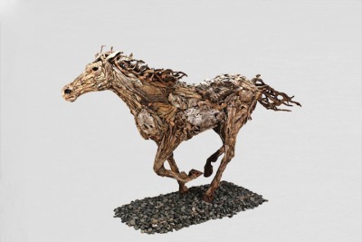 JAMES DORAN-WEBB
British sculptor James Doran-Webb uses driftwood and recycled metal to construct remarkable, life-size sculptures of various animals. From horses and dogs to a lion and a deer, the artist has a vast collection of wooden animals, each boasting a uniquely textured construction.
http://jamesdoranwebb.com