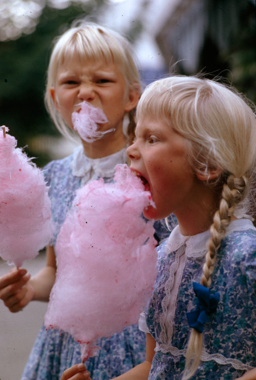 natgeofound:

Girls eat large swirls of cotton candy in Copenhagen, Denmark, January 1963.Photograph by Gilbert M. Grosvenor, National Geographic
