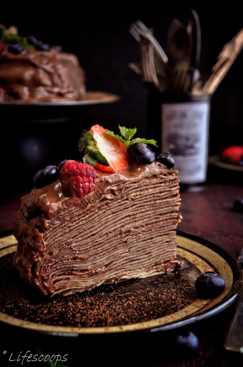 gastrogirl:

crepe cake with blackberry schnapps chocolate mousse.
