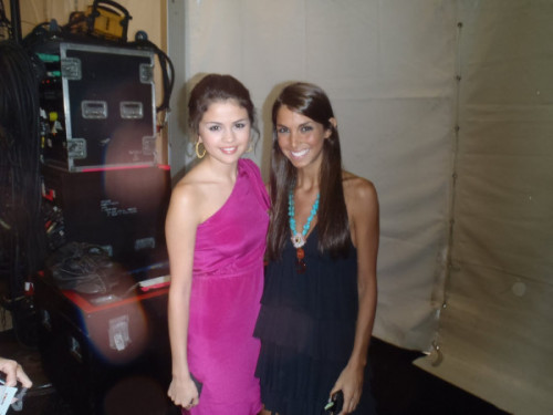 New photo of Selena and a fan backstage at the Beach Bunny Swimwear 2011 fashion show!