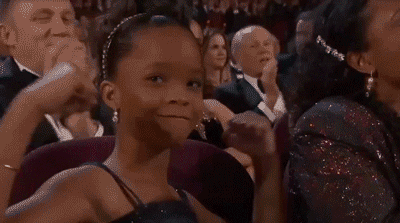 Gif of Quvenzhané Wallis flexing in her seat at the Oscars.