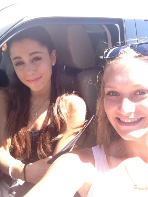 Ariana with a fan yesterday.