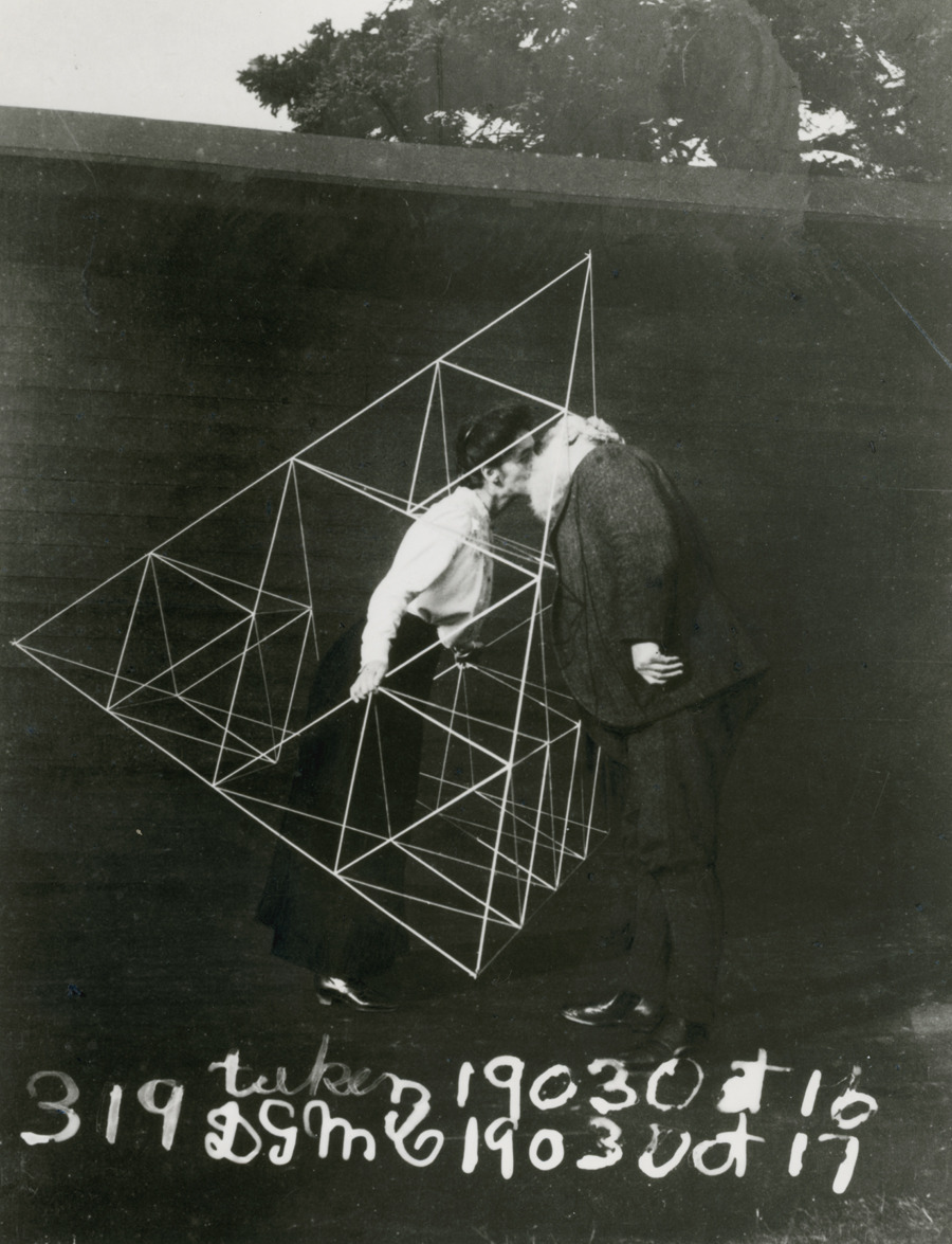 Alexander Graham Bell and Mabel kissing within a tetrahedral kite, October 1903.Photograph courtesy Library of Congress