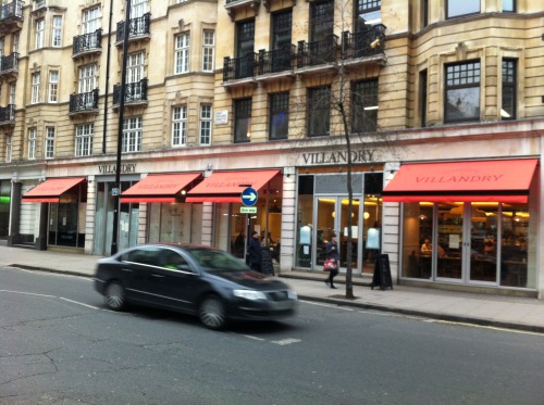 Recover of folding arm awnings at Villandry in Great Portland Street, London.