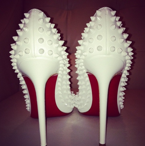 Khloe kardashians all white spiked pigalles give us serious shoe envy!! Perfect for white winters!