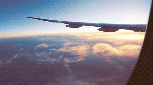 Plane flying through the clouds gif