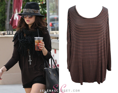 selenascloset: <br /><br /> Selena Gomez was spotted out and about in Hollywood showing off her long legs in a tee and shorts. She wore the Michael Lauren Hunter Long Sleeve Draped Tee in color Coffee Bean, which can be yours from LaurenMoshi.com for $72.00. <br /> Buy it HERE <br /> She also wore a Forever 21 hat, Cartier bracelet, Free People necklace, Dream Out Loud boots and carrying a Dolce &amp; Gabbana bag. <br /><br /> Hey everyone. We made an update to this post about the top that Selena wore over the weekend. Check the post for details :)