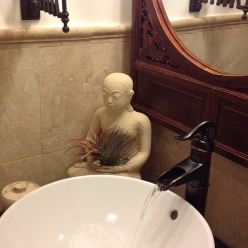 #7vignettes #bathroom #buddha #sink #faucet #asian #rustic #travertinetiles #chinesemirror #decor #zen #eclectic #interior #tuscanbronze #interiordecor #airplant #tillandsia
