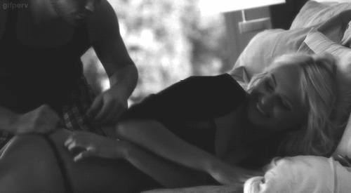 A sexy blonde enjoys a little spanking in bed