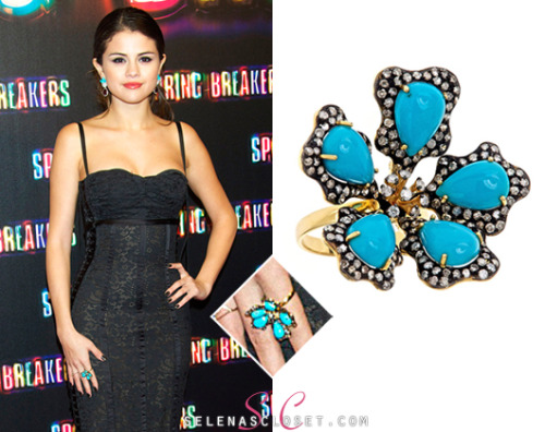 Selena Gomez stepped onto the red carpet premiere of &#8220;Spring Breakers&#8221; in Madrid sporting some turquoise jewels. She wore a J Hadley Turquoise Flower Ring, which can be yours for a hefty $3,250.00. <br /> Buy it HERE <br /> She wore this ring with her Dolce &amp; Gabbana dress, Casadei Heels and Dana Rebecca earrings.