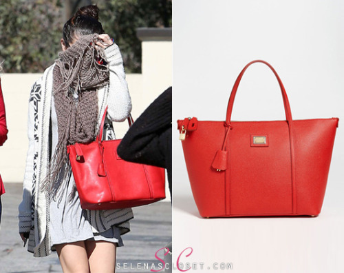 Selena Gomez shied away from the cameras today while sporting her favorite handbag in a different color! She carried a Dolce &amp; Gabbana &#8216;Miss Escape&#8217; Classic Leather Tote in color Red. This bag is on sale from Nordstrom.com for $1,195. <br /> Buy it HERE <br /> She&#8217;s also wearing an Ecote cardigan, Urban Outfitters scarf and Vince Camuto boots.
