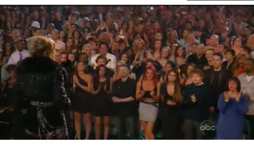 Selena in front of Madonna and next Ed Sheeran