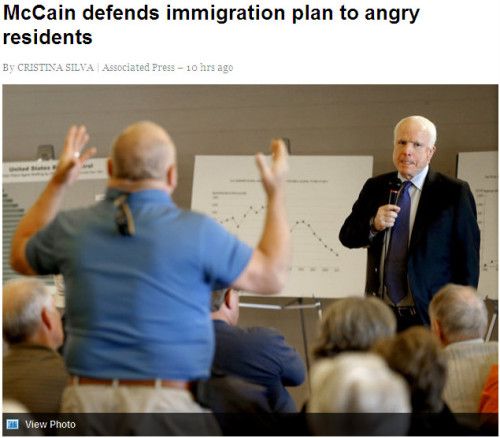 AP - 'McCain defends immigration plan to angry residents'