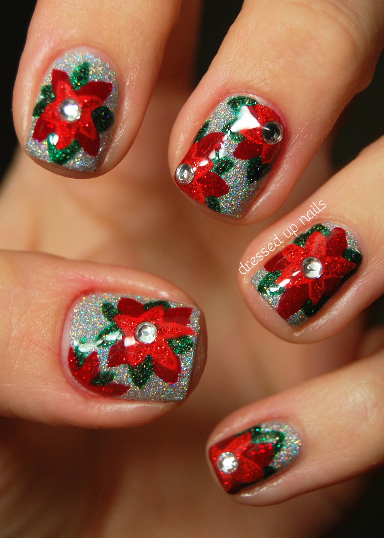 dressedupnails:

Today I have my first holiday nails to show y’all! I just joined a nail art group that posts a week’s worth of nails each month relating to a specific theme and this month’s theme is (of course) FESTIVENESS! So I hope y’all are ready for five sweet (and GLITTERY) holiday-themed manis this week cuz I’m super pumped to show you them. I did these glittery poinsettia nails a couple weeks ago and it’s been hard to wait to post them because I love them a lot… so much that I might re-do them for my actual Christmas nails. You can (AND SHOULD) go check out my blog post for more pictures and an explanation of how I did these!
P.S. GLITTER!!!
Facebook | Instagram @dressedupnails
