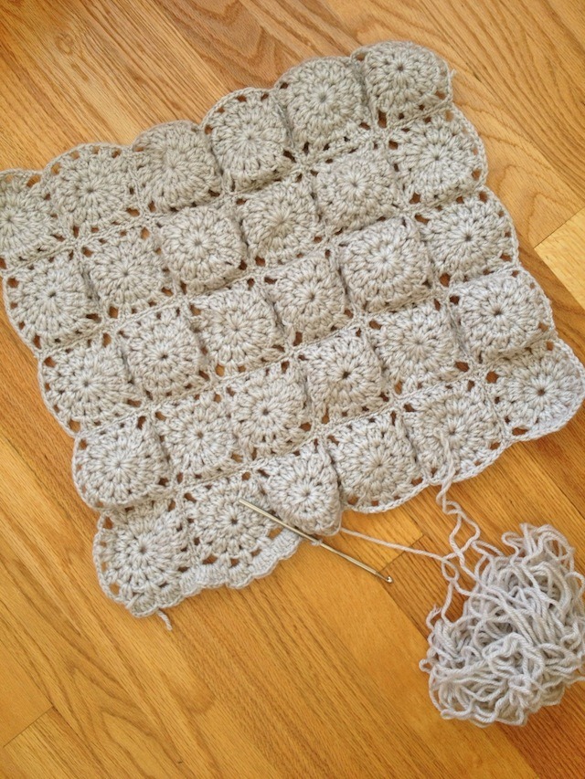 crocheted baby blanket in grey