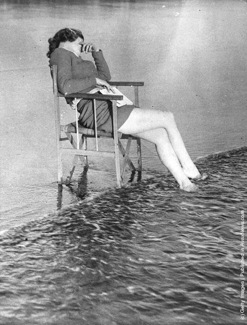 valscrapbook:

vintageeveryday: The tide comes in on a woman at Barry Sands who has fallen asleep in the sunshine. 1938.
