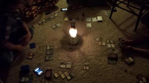 Magic: the Gathering - after dark
@JesickaChaos posted this pic of an MTG game with unique lighting.  WotC minion @monty_ashley  not missing a beat provided this caption “We spent all our money on Magic cards. They shut off our electricity, and we had to burn the table to keep warm”