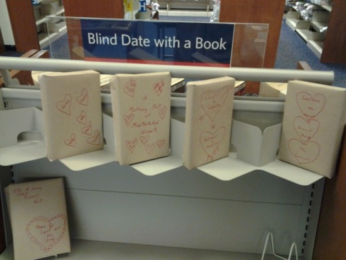 


“My local library branch started doing this “Blind Date with a Book” thing, thought you guys might like it. The shelf was full when we got there, but was like this as we were leaving. The books are wrapped in paper and have different designs on them, and then a few words vaguely describing the subject matter of the book. Things like “Drama”, “Plot Twists”, “espionage”, etc. The only thing exposed on the book is the barcode that you use to scan the book out. I thought it was a pretty cool idea.”


