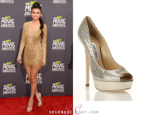 selenascloset:We are OBSESSED with these Jimmy Choo ‘Vibe’ peep-toe pumps that Selena Gomez wore to the MTV Movie Awards yesterday. Its such a bummer that her exact sandals are sold out but its still available in multicolored glitter at Saks Fifth Avenue for $795.Buy them HEREIf you’d like a less pricey alternative check out these Anne Klein Serafina Pumps on sale for $59.99She’s also wearing a Julien Macdonald dress