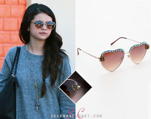 Selena Gomez was spotted out at lunch with Lily Collins yesterday wearing a slightly modified pair of Urban Outfitters Dollhouse Sunglasses in color Gold. These sunglasses are on sale for $24.00. <br /> Buy them HERE <br /> Thanks to everyone who suggested they were from Urban Outfitters. <br /> She&#8217;s also wearing a Free People necklace, Steve Madden boots and carrying a Dolce &amp; Gabbana bag.