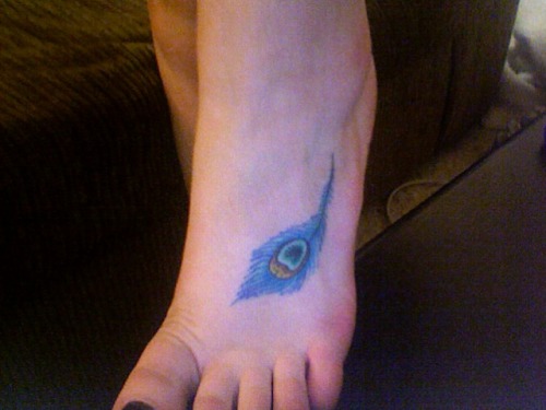 fuckyeahtattoos its a peacock feather i got it about a year and half ago