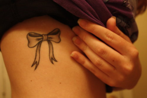 My first tattoo. I love bows, and for me it symbolizes that beauty equals pain, being that it was done on one of the most painful places.
