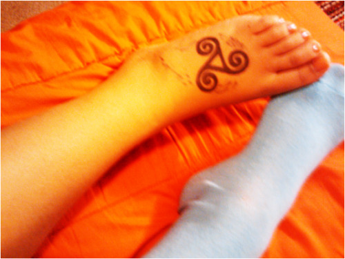 My foot tattoo of the Celtic symbol of sisterhood. My cousins and I share a