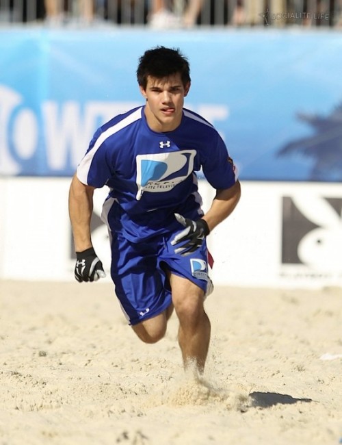 Taylor Lautner Running for a pass, @ The Direct TV Celebrity Beach Bowl. Miami, FL 2/6/2010