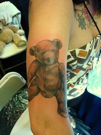 teddybear with gun tattoo Justin at Kats Like Us Tattoos