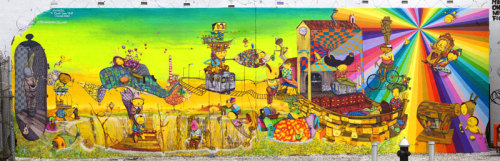 The mural at Houston St. and Bowery in the Lower East Side is a magnificent sight indeed. Painted in July &#8216;09 by Brazilian-born identical twin brothers, Gustavo and Otavio Pandolfo, otherwise known as Os Gemeos - it was part of The Keith Haring Foundation on the wall he originally painted in 1982; and Deitch Projects, which is also soon to be leaving NYC.  I absolutely ADORE this mural. It&#8217;s so vibrant and brings so much life (and joy) to that intersection. Every time I pass it, I start giggling. It&#8217;s just full of interesting and fantastical creatures, yet with scenes from their real life - riding the N train and bicycling in the city. Of course, I LOVE the fish!&nbsp;  Get a close up of the mural from my &#8220;Sights in the City&#8221; album.  Be sure to view it in detail before it gets painted over March 31st.  (I wish they&#8217;d just leave it, it&#8217;s so lovely and bright.)