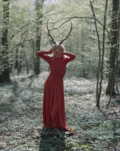 Girl with antlers in a red dress Credits Unknown