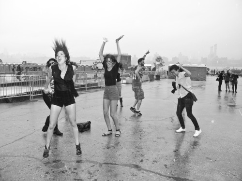 People dancing in the rain