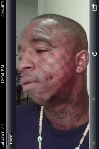 Gucci Mane is not getting any chick after this tat so retarded