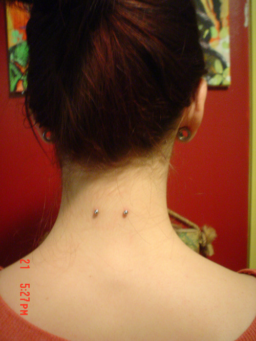 surface nape piercing on red by Paco&#8217;s Piercings on flickr (click