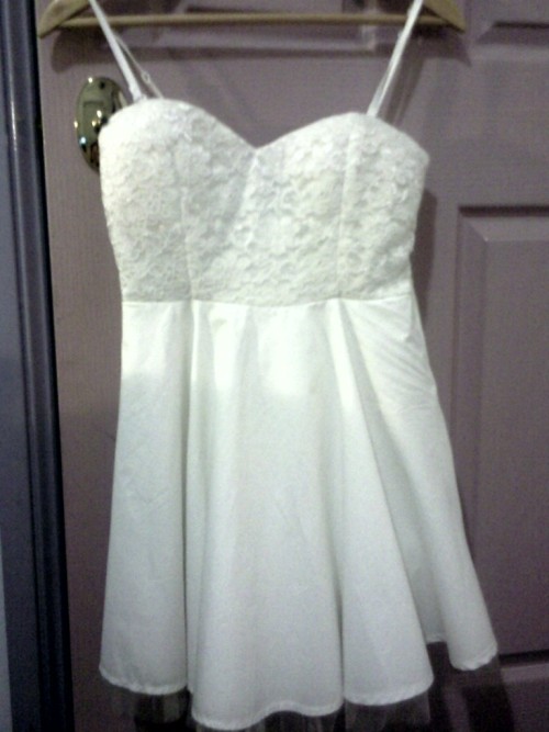 sent in a picture of her formal dress. It’s a white strapless dress ...