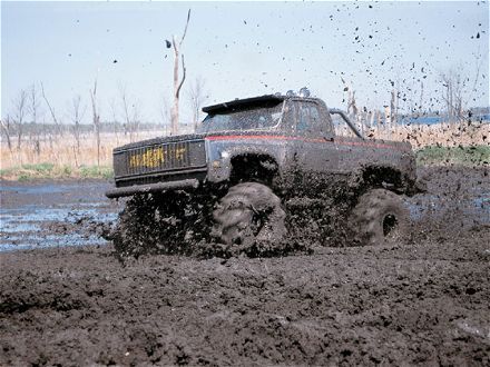 Trucks In Mud. jacked up truck mudding mud