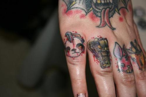  finger one animals face tattooed gorrila lion i dont know exactly 