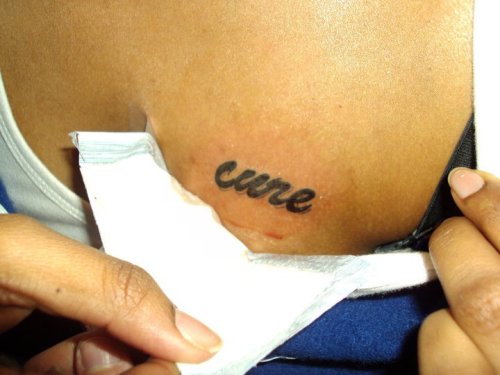 word cure on my left chest my mom was diagnosed with breast cancer less