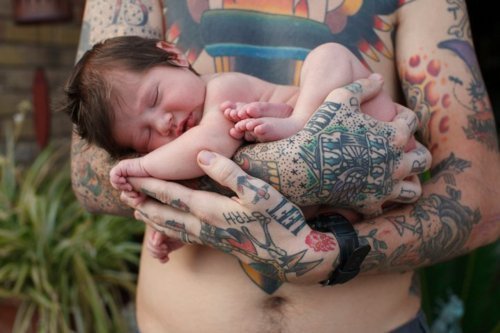 Men with Tattoos holding babies