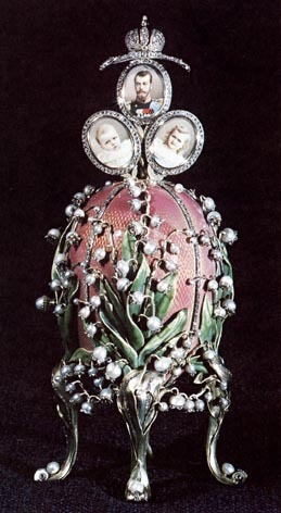 Easter 1898. Nicholas II presented Empress Alexandra with the Lilies of the Valley Egg. Made of gold overlaid with translucent rose pink enamel,  with enameled green  leaves and pearls applied to the surface in imitation of lilies, complete with rose-cut diamond &#8216;dewdrops&#8217;.
Every Faberge Egg was designed to hold a surprise. Press a pearl mounted in gold and three oval framed portraits appear, one of the Tsar, the others of the royal princesses, the Grand Duchess Olga (born 1895) and the Grand Duchess Tatiana (born 1897). 
The Lilies of the Valley Egg was one of nine Imperial Faberge Eggs once part of the Forbes Collection assembled by the late Malcolm Forbes acquired by Ukrainian-born businessman Viktor Vekselberg in 2004. Held by the Link of Times Foundation, Moscow.