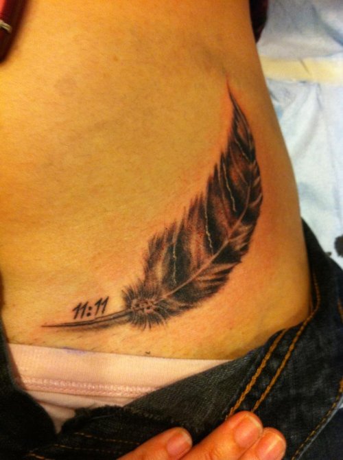 My tattoo A barn owl feather with 1111 on my left hip bone My tattoo