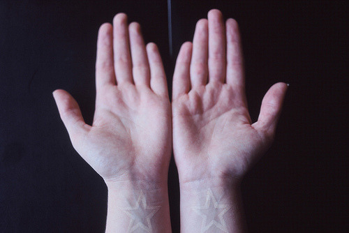 white ink star wrist tattoos