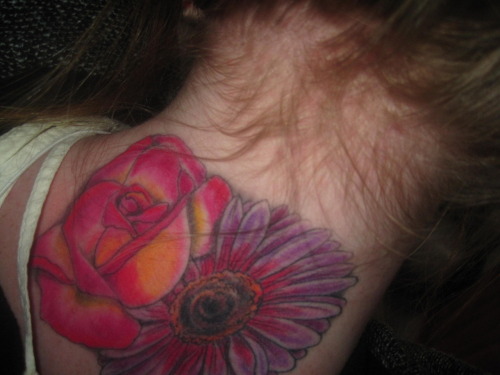 gerber daisy tattoo. a rose and a gerbera daisy for
