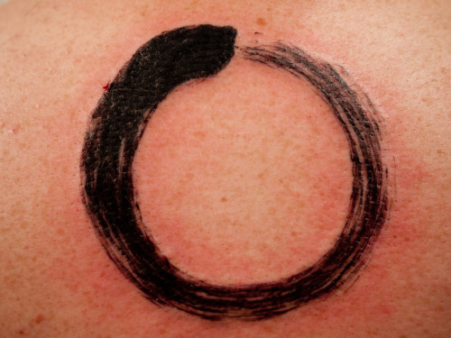 My first tattoo. An Enso, Japanese Zen circle brush-stroke. By Colin Stevens who works out of Body Manipulations in San Francisco, CA. Hi father is John Stevens, author of Japanese Calligraphy books and an Aikido master and friends with my father.