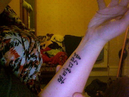 domino goldfish tattoo. A tattoo is a true poetic