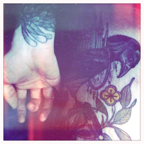 just a photo showing a part of my thigh tattoo and my wrist at the end of my