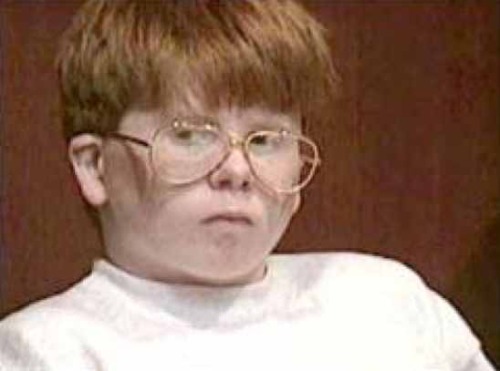 boy with brown hair and glasses. At 13, Eric Smith was bullied